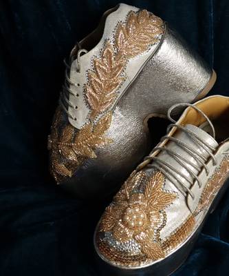 Gold leather embroidered sneakers 1