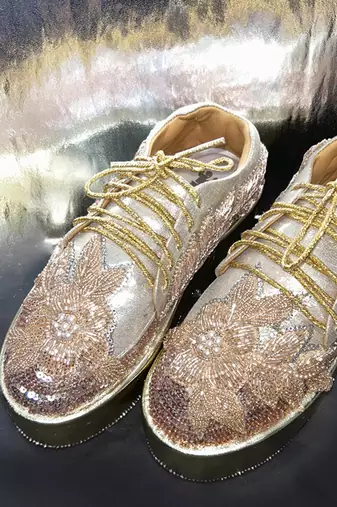 Gold leather embroidered sneakers