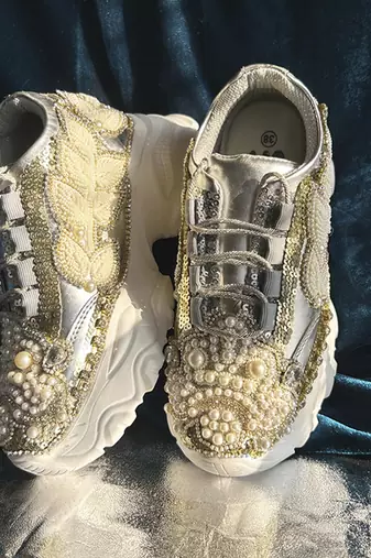 Gold leather embroidered sneakers