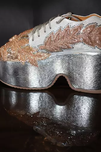 Gold leather embroidered sneakers