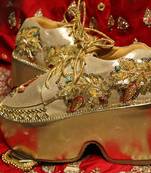 Gold leather embroidered sneakers