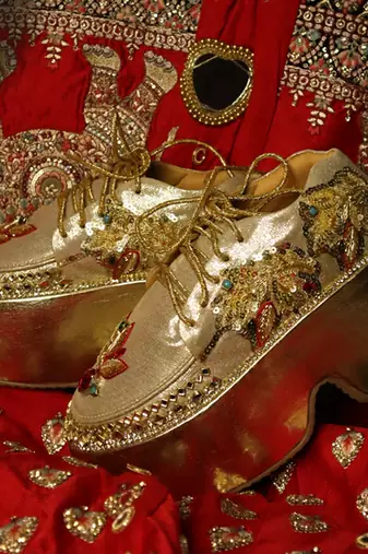 Gold leather embroidered sneakers