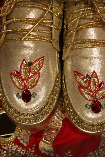 Gold leather embroidered sneakers