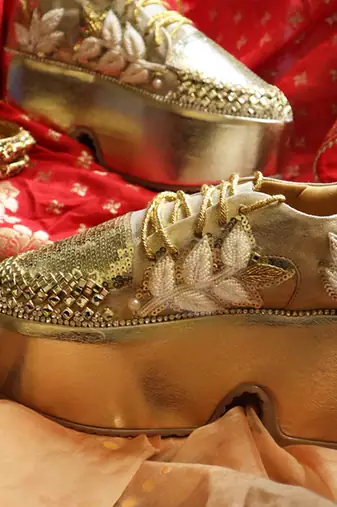Gold leather embroidered sneakers