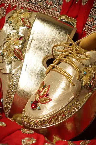 Gold leather embroidered sneakers