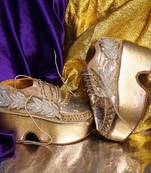 Gold leather embroidered sneakers