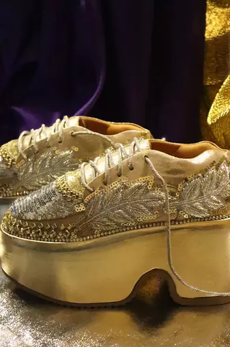 Gold leather embroidered sneakers