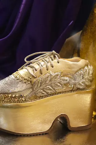 Gold leather embroidered sneakers
