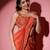 Rust organza embroidered saree with scallop border