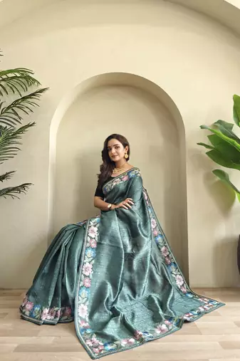 sea green tussar saree with contrast embroidery