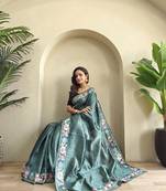 sea green tussar saree with contrast embroidery