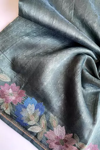 sea green tussar saree with contrast embroidery