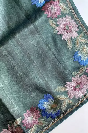 sea green tussar saree with contrast embroidery