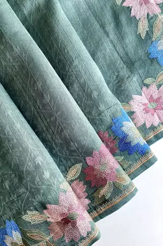 sea green tussar saree with contrast embroidery