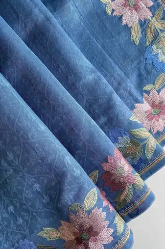 teal tussar saree with contrast embroidery