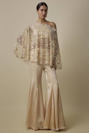 Beige satin plain blouse and pant paired with embroidered cape