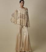 Beige satin plain blouse and pant paired with embroidered cape