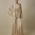 Beige satin plain blouse and pant paired with embroidered cape