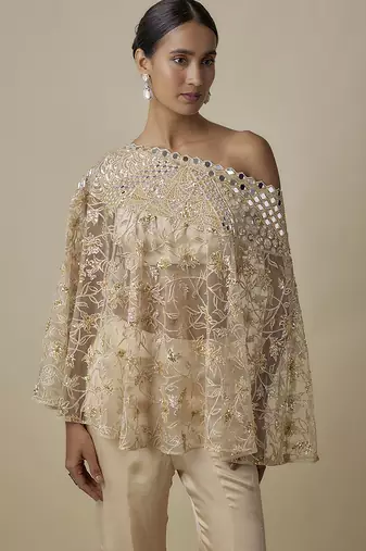 Beige satin plain blouse and pant paired with embroidered cape