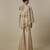 Beige satin plain blouse and pant paired with embroidered cape
