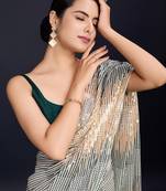 cream Embellished georgette saree with unstitched blouse