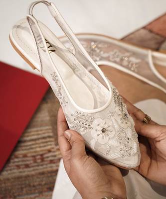 White embroidered leather flats 1