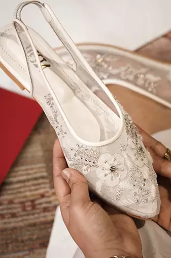 White embroidered leather flats