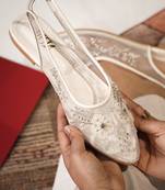 White embroidered leather flats
