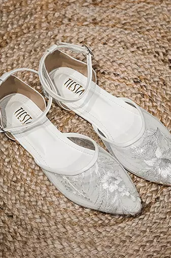 White embroidered synthetic leather sling back flats