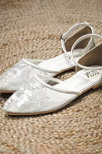 White embroidered synthetic leather sling back flats