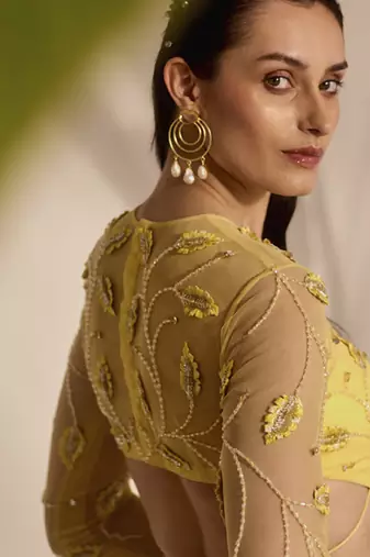 yellow embroidered net lehenga with blouse