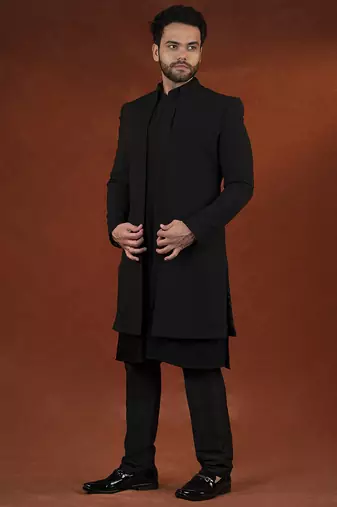 Anupam kher in black shimmer jacket kurta set