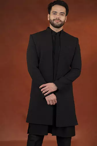Anupam kher in black shimmer jacket kurta set