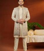 Cream heavy embroidered front open sleeveless jacket kurta set