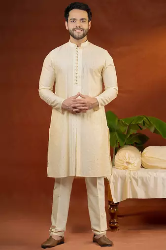 Cream heavy embroidered front open sleeveless jacket kurta set