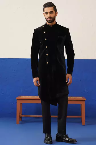 Rishabh chawla in black velvet asymmetric indowestern