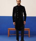 Rishabh chawla in black velvet asymmetric indowestern