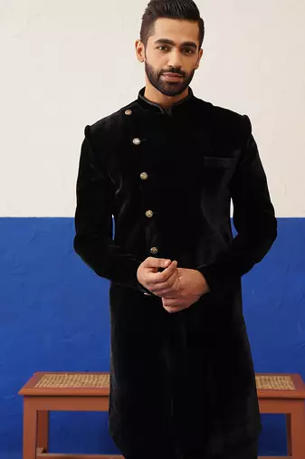 Rishabh chawla in black velvet asymmetric indowestern