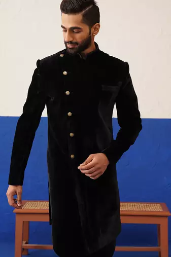 Rishabh chawla in black velvet asymmetric indowestern