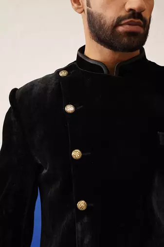 Rishabh chawla in black velvet asymmetric indowestern
