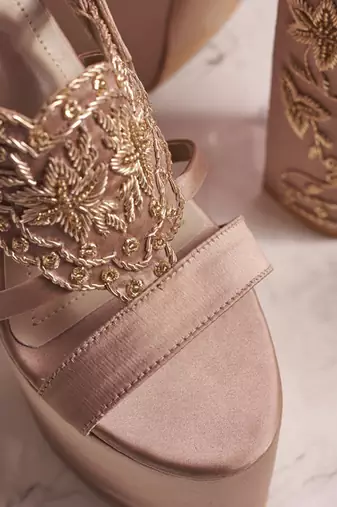 Nude woven leather heels