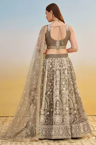 IVORY NET FABRIC LEHENGA WITH SEQUINS AND THREAD EMBROIDERY WORK