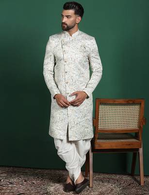 Cream sherwani dhoti set with paisley design     subtle indian groom outfit 1