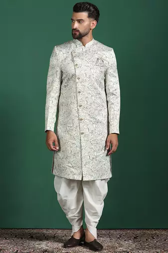 Cream sherwani dhoti set with paisley design     subtle indian groom outfit