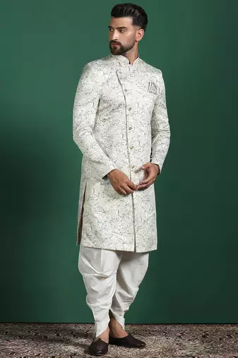 Cream sherwani dhoti set with paisley design     subtle indian groom outfit