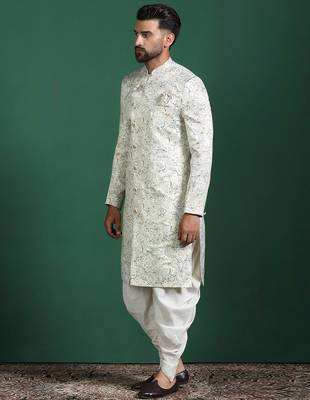 Cream sherwani dhoti set with paisley design     subtle indian groom outfit 4