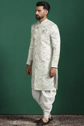 Cream sherwani dhoti set with paisley design     subtle indian groom outfit