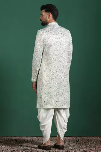 Cream sherwani dhoti set with paisley design     subtle indian groom outfit
