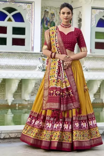 mustard Tussar Silk Patola Print Lehenga Choli with Foil Work Detailing