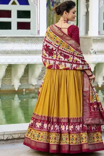 mustard Tussar Silk Patola Print Lehenga Choli with Foil Work Detailing